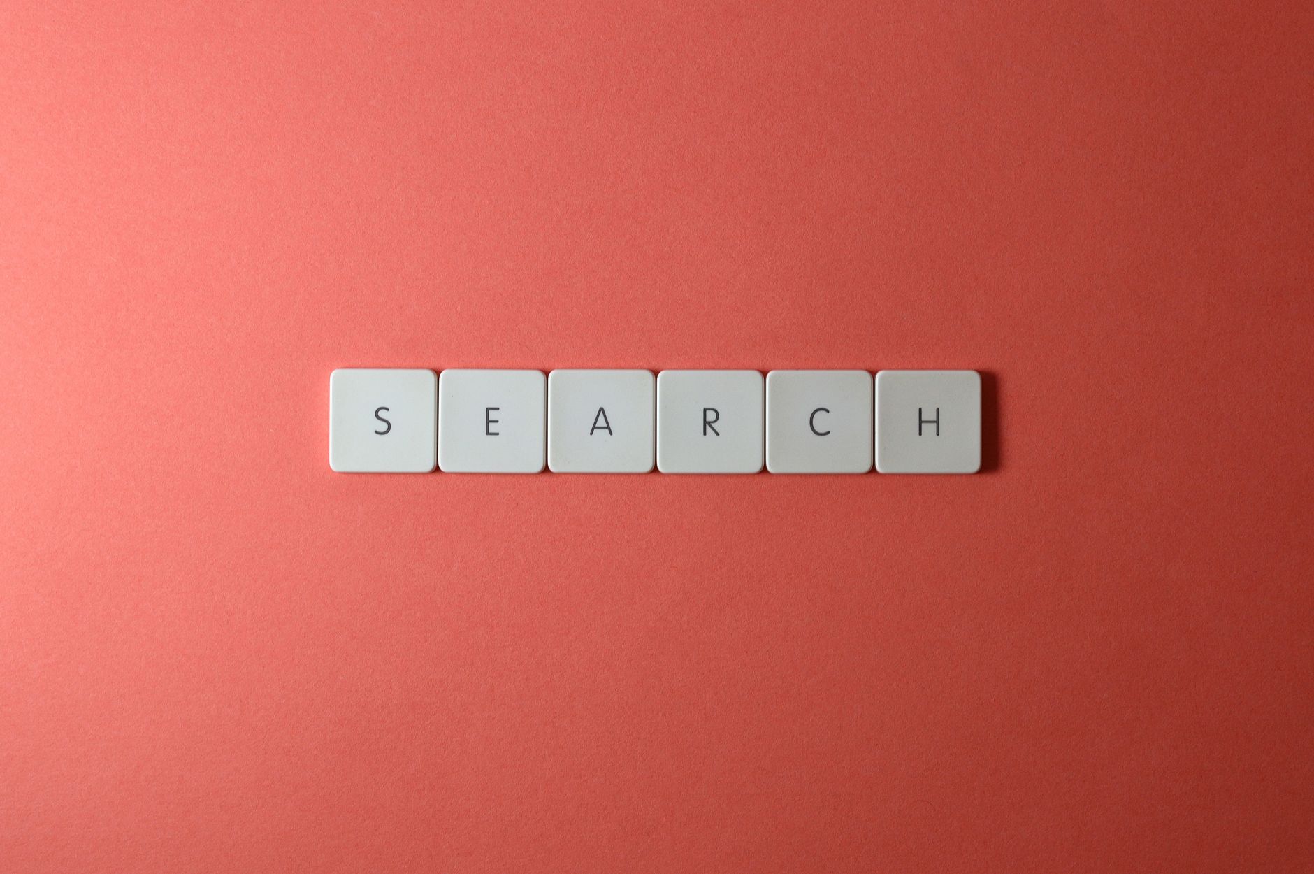 6 Best WordPress Login Page Customizer Plugins for Custom Branding (2026-2027) 1 White keyboard keys spelling 'search' on a bold red surface, conceptual design with copyspace.