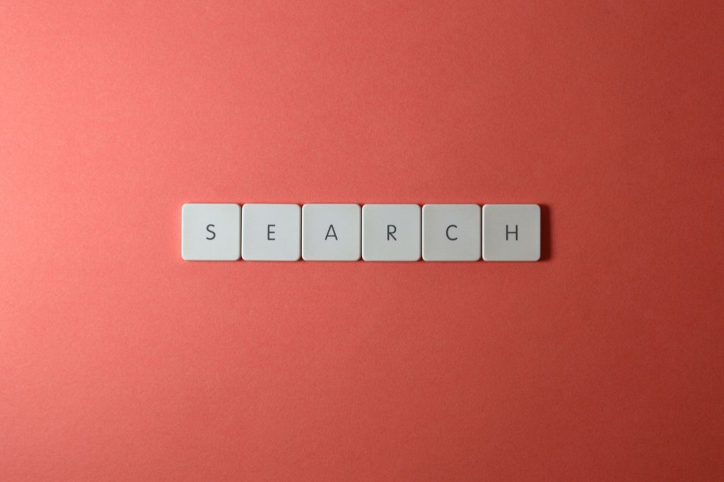 5 Power Moves for AI Email Marketing WordPress Plugin 1 White keyboard keys spelling 'search' on a bold red surface, conceptual design with copyspace. - primary_keyword: A