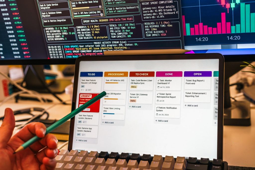 Download the Free Plugin to Consolidate Your WordPress Marketing Tools 1 Detailed view of a business workflow setup with tablet and multiple screens displaying data charts.