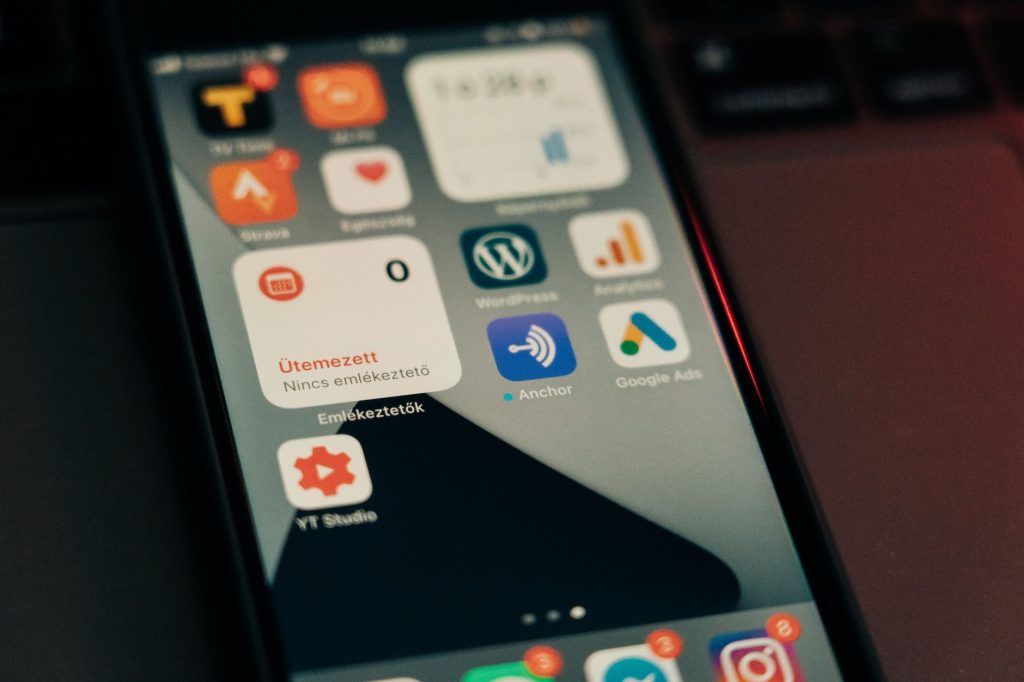 Automating Your Complete WordPress Marketing Funnel with AI — From Visitors to Repeat Customers 1 Close-up view of smartphone screen featuring various app icons and notifications. - WordPress marketing automation funnel